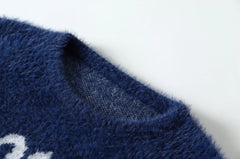 Jungwon Indigo “Don’t Burn Our Future” Knit Sweater